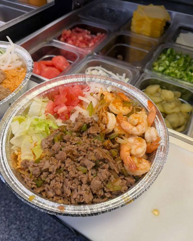 Rice bowl topped with steak and shrimp