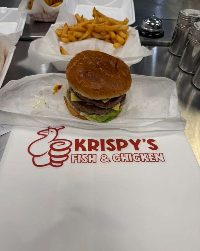 Cheeseburger with fries on Krispy's paper