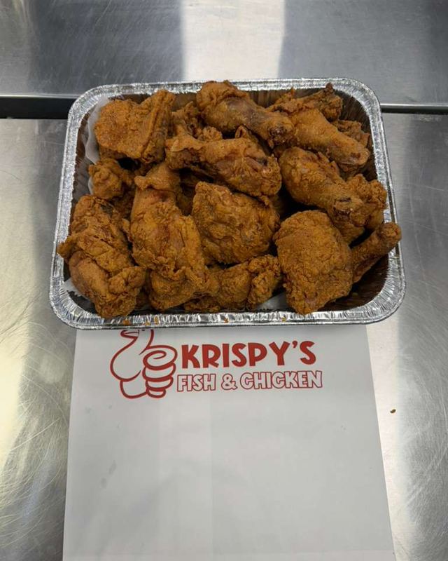 A pan of fried chicken on Krispy's paper
