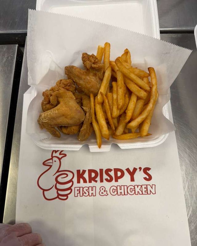 Fried chicken and fries in a Krispy's box