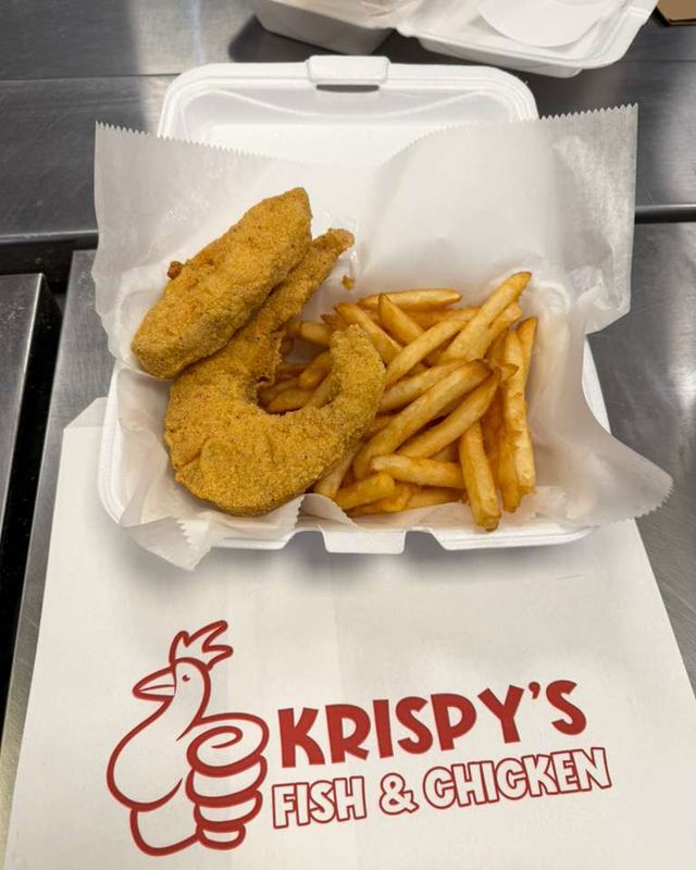 Fried fish dinner with fries in a Krispy's box