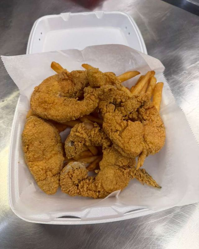 Fried fish and jumbo shrimp with fries