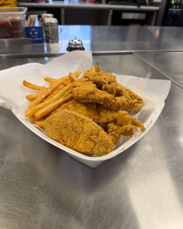 Fried fish fillets and shrimp with fries
