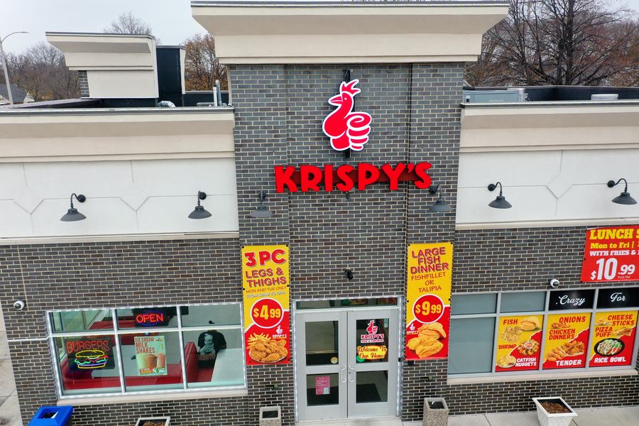 Krispy's front doors under the red logo sign