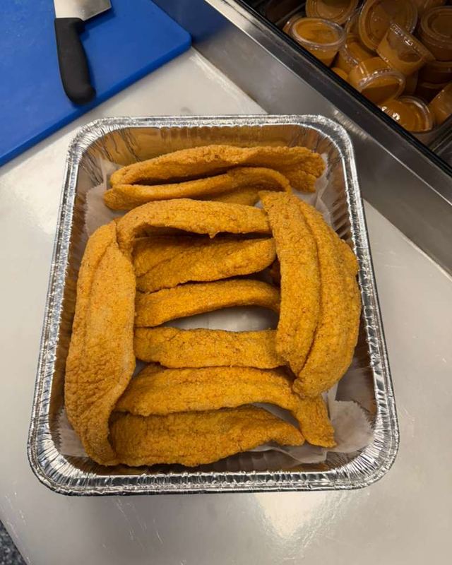 A pan of fried fish fillets