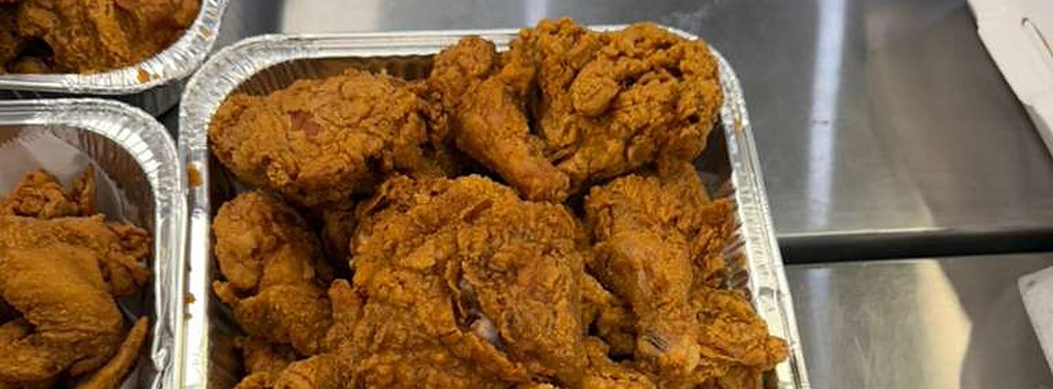 A pan of fried chicken, hot out of the fryer at Krispy's